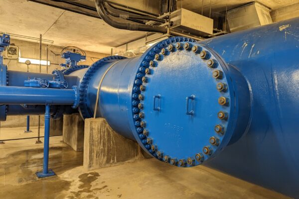 A large blue pipe with bolts.